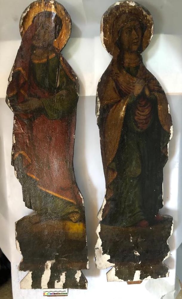 The Virgin Mary and Saint John, paired carved cut-out figures, before treatment
