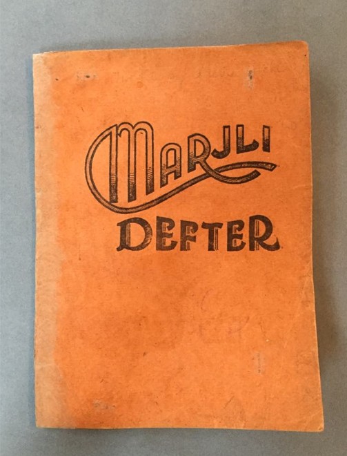 The Marjli Defter front cover after treatment, flattened and surface cleaned