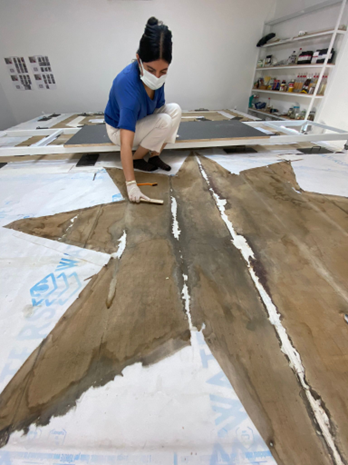 Star fragments before treatment, with breaks and plaster losses